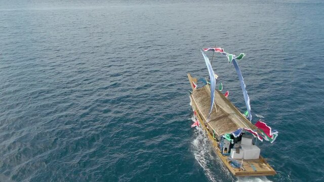 Tourist Sama Lepa House Boat in Tawi-Tawi, Philippines Cruising on Celebes Sea Followed by a Drone Aerial