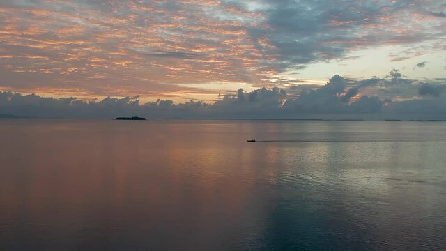 Fishing Boat Cruising Along the Sunset Horizon in Tawi-Tawi, Philippines Drone Arial Flying Up
