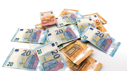 Obraz na płótnie Canvas several Euro cash banknotes scattered on the white background