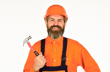Technical work. Bearded mature man in uniform. Guy with hammer. Good hammer. Almost every household has hammer. Estimate materials requirements for projects. Professional master repair roof