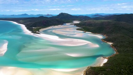 Rotating cinematic drone shot of Whitehaven Beach Whitsunday Island Australia