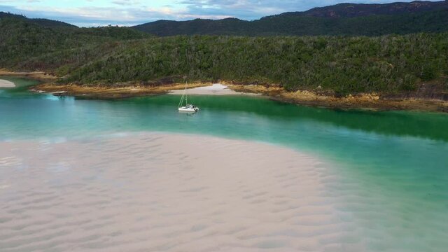 Drone shot of sailboat in water at Whitehaven Beach Whitsunday Island Australia