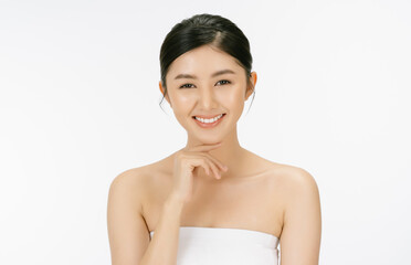 Happy beautiful girl with clean fresh skin and health wellness with hand on chin looking at camera...