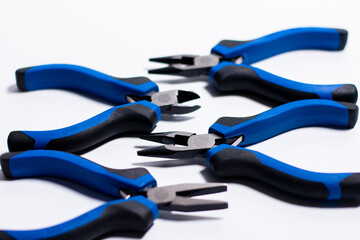 A set of four different types of side cutters.