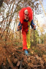 Halloween holiday party concept. Masquerade and carnival concept. Scary clown costumes. Creepy...