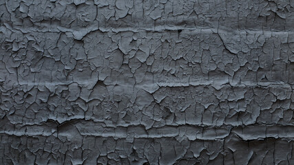 grey wall with cracked paint