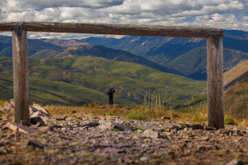 Hiker looking out over Glacier National Park mountain range