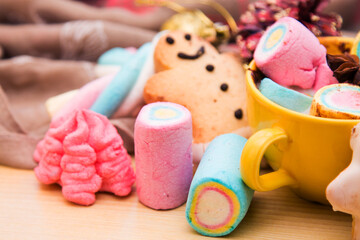 cup of chocolate with marshmallows and Christmas decorations and cookies