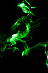 Green smoke on black background