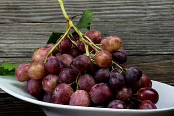 bunch of red organic grapes on a tray