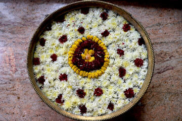 Fototapeta na wymiar Flower decoration in big flower bass(flower pot) use in hotel lobby, marriage function, party.