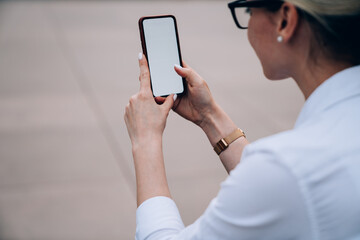 Crop woman surfing internet during break
