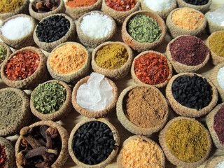 Obraz na płótnie Canvas Colorful, aromatic spices on a wooden background 