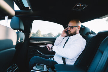 Pensive man talking on smartphone