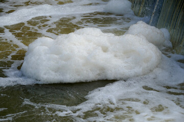 Foaming unclean water, concept of pollution and water contamination