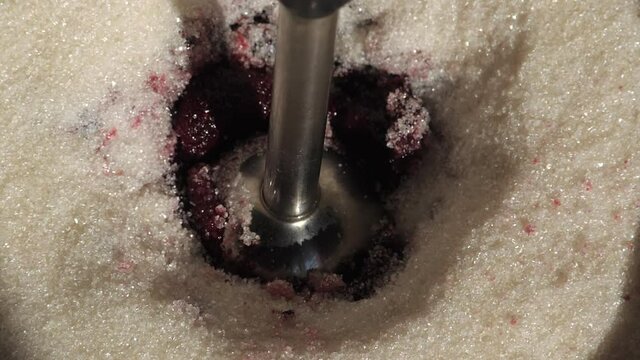 Grinding raspberries with sugar. Operation of the electric blender. Preparations for the winter. Fresh red berry jam.