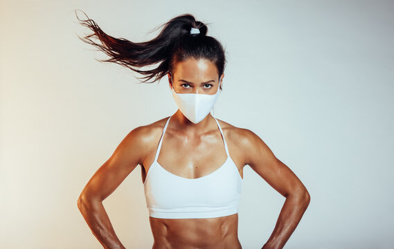 Muscular Sports Woman With Face Mask