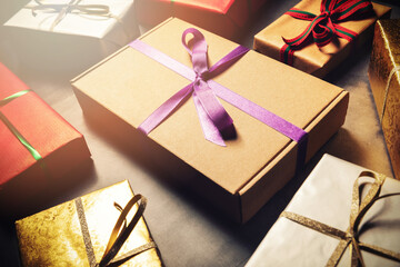 gift wrapping service - wrapped present boxes on dark table