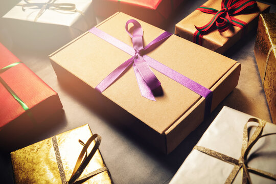 Gift Wrapping Service - Wrapped Present Boxes On Dark Table