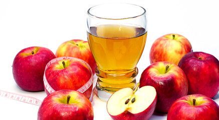 apple cider vinegar,apple and apple juice with tape measure on white background, healty food, drink for weight control in summer.	
