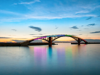 Long exposure of Xiying Rainbow Bridge at sunset in Magong, Penghu Island, Taiwan