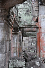 Fototapeta na wymiar Hallways and columns in the ancient Khmer temples at the Angkor Wat complex, in Siem Reap, Cambodia