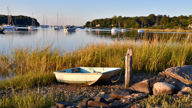 A fisherman's dinghy tied up at the shore in early autumn.  Setauket Harbor, Long Island.