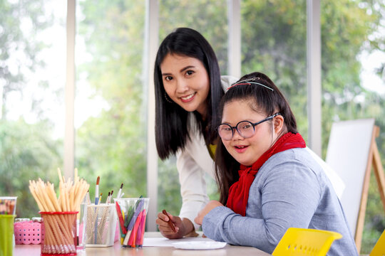 Disabled Kids Classroom, Children Having Fun During Study At School, Kids Learning And Playing Together, Schoolgirl Having Fun With Teacher In Art Classroom