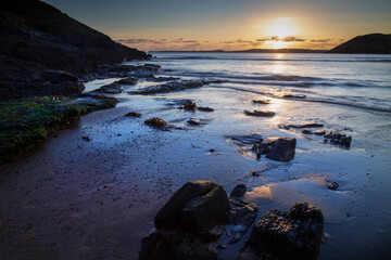 Low water at sunset on Manorbier beach in West Wales, UK
