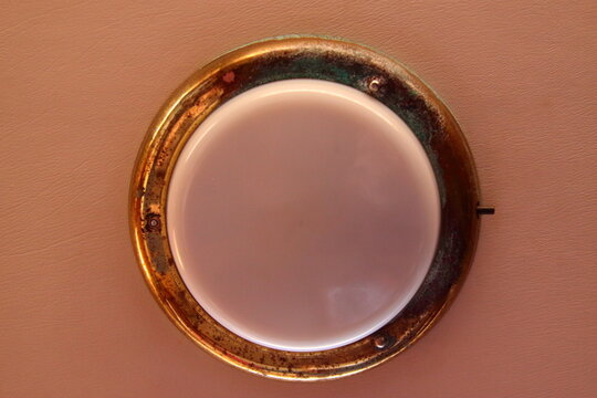 brass-framed wall planon of a sailboat