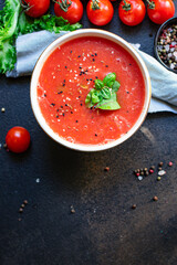 tomato carrots or peppers
soup gazpacho portion in plate on the table tasty serving size top view copy space for text keto or paleo diet food background rustic