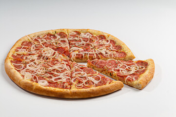 Pepperoni pizza whith onion on white background. Copy space. Selective focus