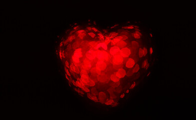 Red heart on black background. Love in the Air.