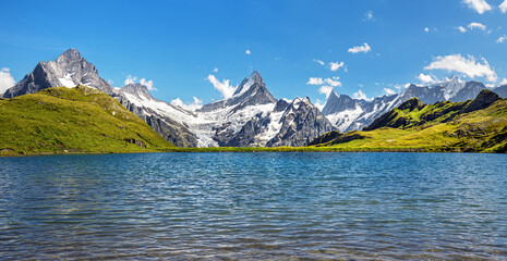 Bernese range above Bachalpsee lake. Peaks Eiger, Jungfrau, Faulhorn in famous location in...