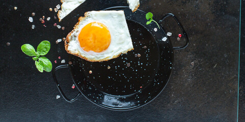 Fototapeta na wymiar fried egg yolk and white, fork for eat omelette fresh dish and ingredients on the table tasty serving size top view copy space for text food background rustic