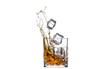 A glass of whiskey with splashes from the ice cube isolated on white. alcohol splashes. whisky or cognac or another type of alcohol.