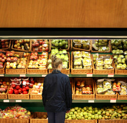 Woman buying fruits at the market	