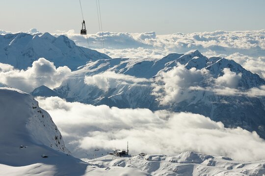 Ski lift cabins in snowy mountains in Les 2 Alpes