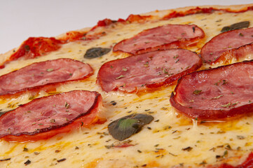 Pepperoni pizza on white background. Copy space. Selective focus