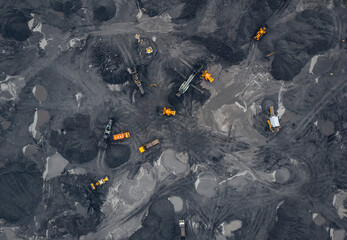 Coal mining an open pit extractive industry, top view aerial