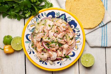 Mexican shrimp raw aguachile on white background