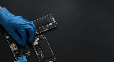 Technician repairing the Cell phone parts and tools for recovery repair phone smartphone and...