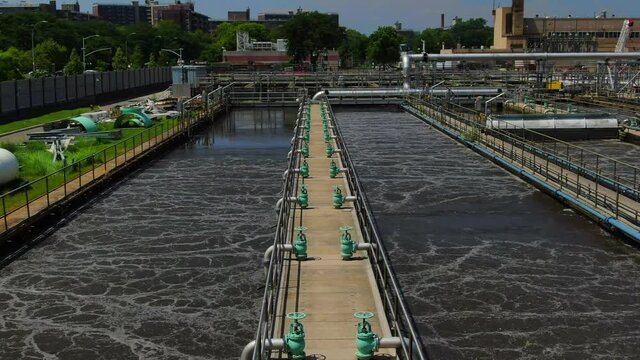 Low Flyover Shot of an Industrial Waste Water Plant in Brooklyn