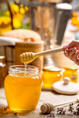 Linden honey in a glass jar with rustic decor