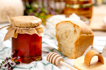 Heather honey in a glass jar with rustic decor