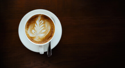 A cup of coffee on a wooden table