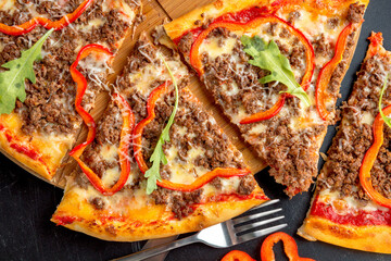 Bolognese pizza with ground beef, cheese, bolognese sauce, bell pepper and parmesan