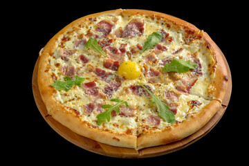 Pizza carbonara. Contains egg yolk, cream, bacon, parmesan. Served on a black background.