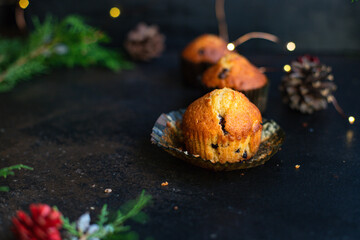 muffins cupcakes chocolate drops
homemade baking cakes on the table christmas lights new year treat tasty serving size top view copy space for text food background rustic