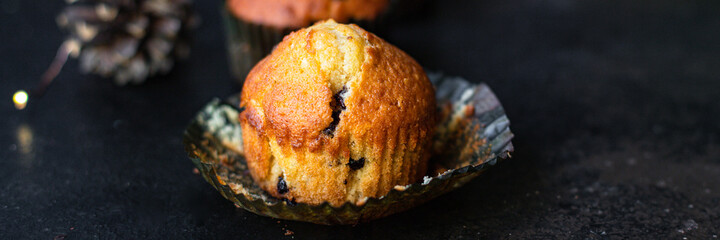 muffins cupcakes chocolate drops
homemade baking cakes on the table christmas lights new year treat tasty serving size top view copy space for text food background rustic